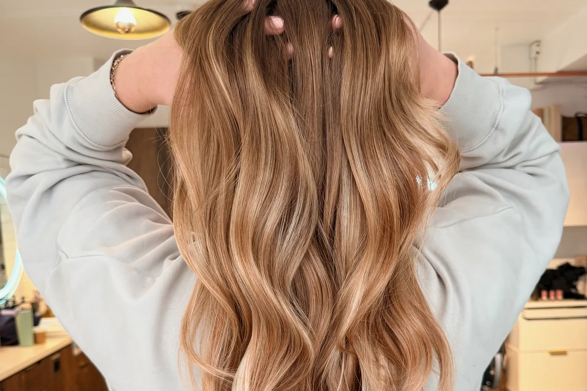 Long wavy dimensional blonde baby lights at Park & Eve Hair Studio