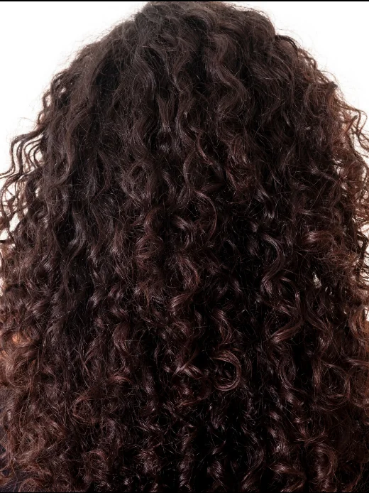 Long, dark brown curly hair with defined, healthy curls