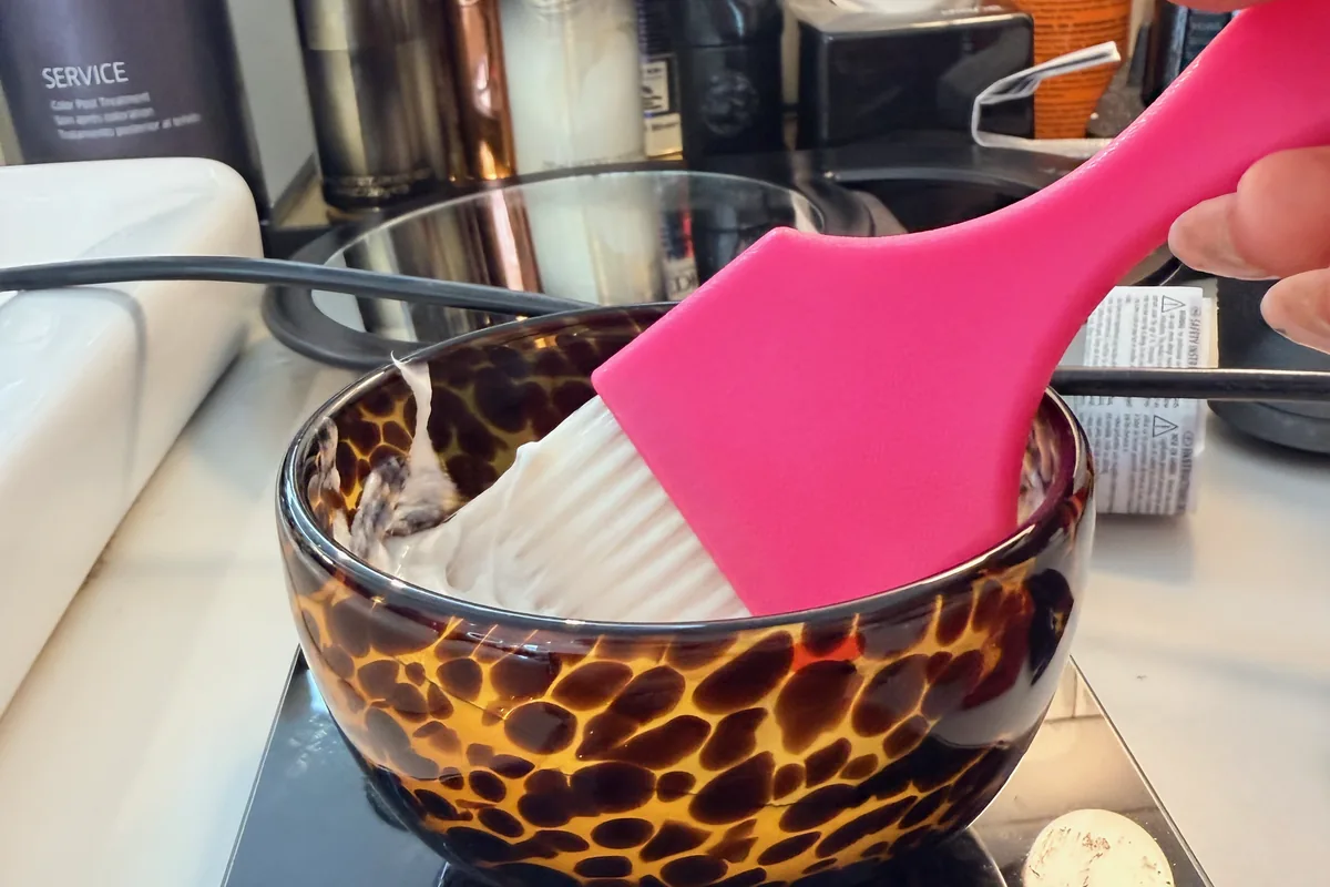 Mixing hair color in a color bowl at Park & Eve Hair Studio in Downtown Los Angeles
