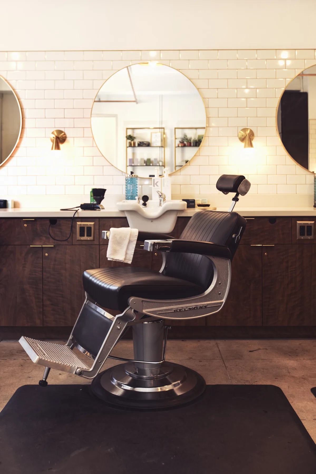 Park & Eve salon interior with brass mirrors and subway tile